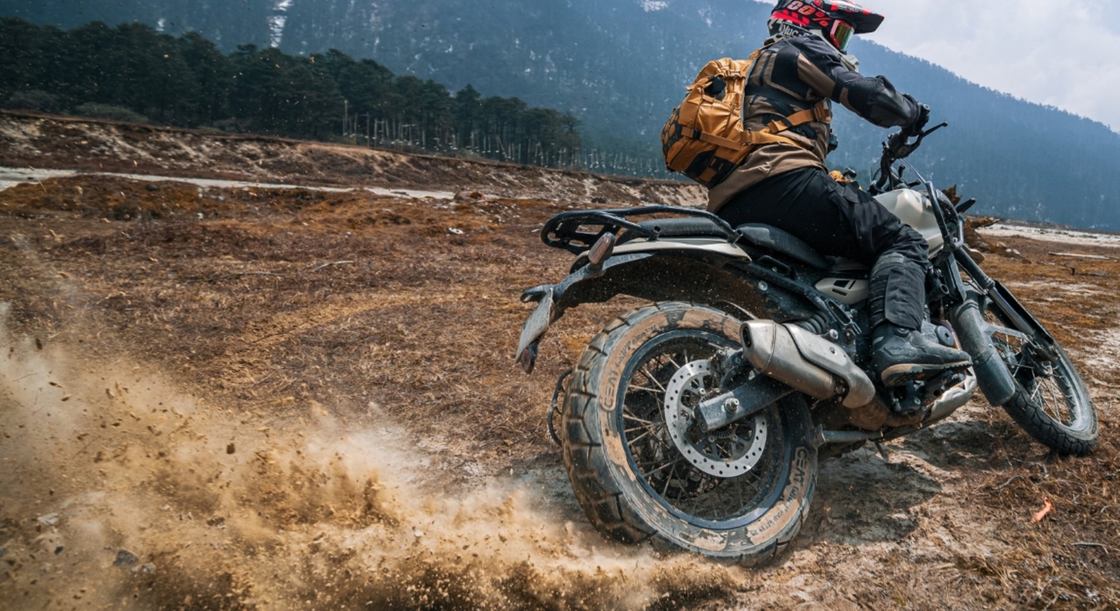 Motorcyclists on uneven ground with the Atlaz collection