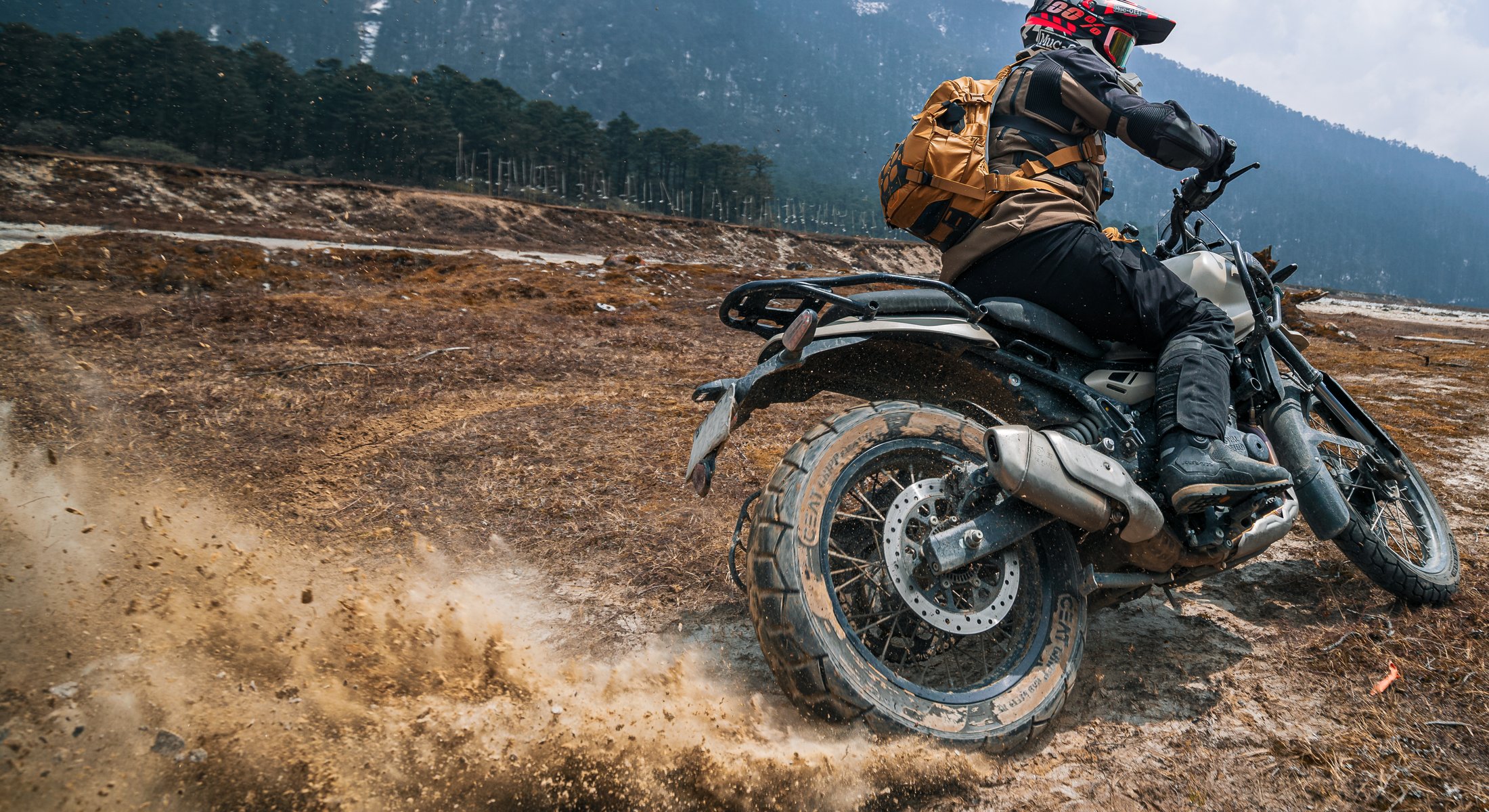 Motorcyclists on uneven ground with the Atlaz collection